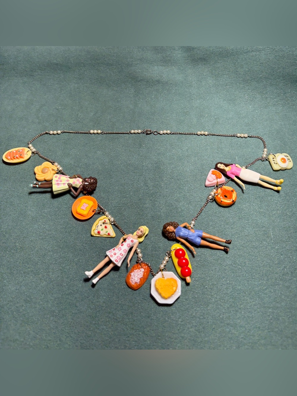 More Barbies & snacks on a long necklace